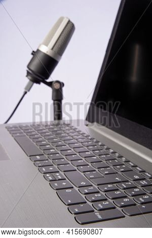 Home Work, Professional Condenser Microphone And Computer On Light Background, Selective Focus.