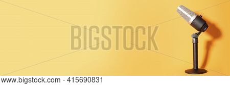 Professional Condenser Microphone With Pedestal Isolated On Orange Background Creating Shadow, Selec