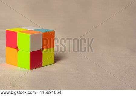 Araras, São Paulo, Brazil, April 4, 2021, Magic Cube On Beige Fabric, Selective Focus.