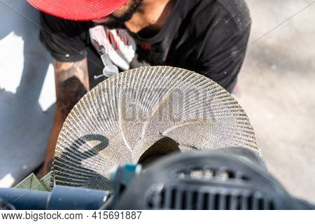 Man's Hands While Grinding Stones To Grind Corn