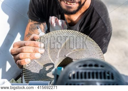 Man's Hands While Grinding Stones To Grind Corn