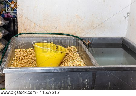 Double System For Washing Corn And Storing Water