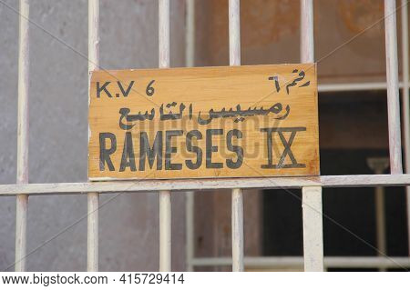 LUXOR, EGYPT - OCTOBER 30, 2008: Sign at the tomb of Ramesses IX (KV 6), the first tomb one encounters within the modern entrance to the Valley of the Kings.