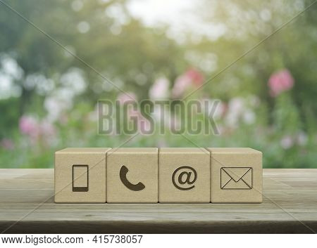 Mobile Phone, Telephone, Email Address, Mail Icon On Block Cubes On Wooden Table Over Blur Pink Flow