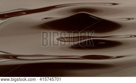 Hot chocolate waves, melted chocolae mixing.