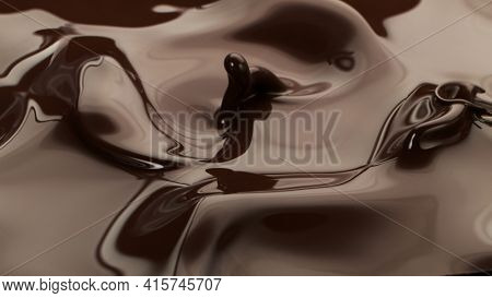 Hot chocolate waves, melted chocolae mixing.
