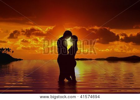 Couple at beach under sunset