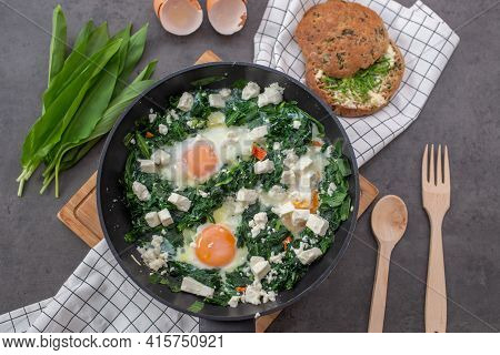 Shakshouka - Middle Eastern Traditional Dish With Poached Eggs And Wild Garlic