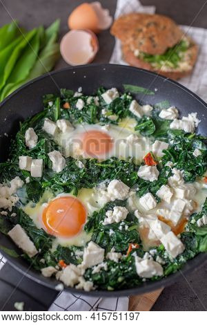 Shakshouka - Middle Eastern Traditional Dish With Poached Eggs And Wild Garlic