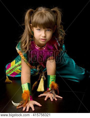 Pretty Little Girl Crawling On Floor. Photo Session In The Studio