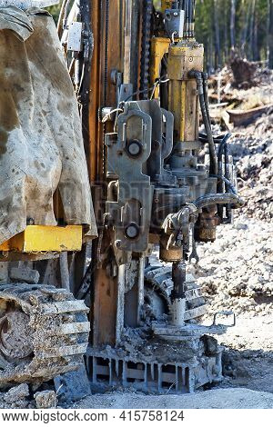 Mini-drilling Rig On Crawler Track On Site Of Sawn Forest Where Large-scale Enterprise Will Be Built