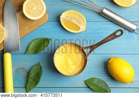 Delicious Lemon Curd And Fresh Fruits On Light Blue Wooden Table, Flat Lay