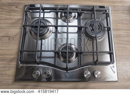 Silver Pan On A Modern Silver Gas Stove In The Kitchen Close-up.