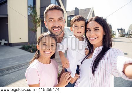 Self-portrait Of Nice Cheerful Lovely Family Embracing Mom Dad Carrying Son Spending Time Fresh Air 