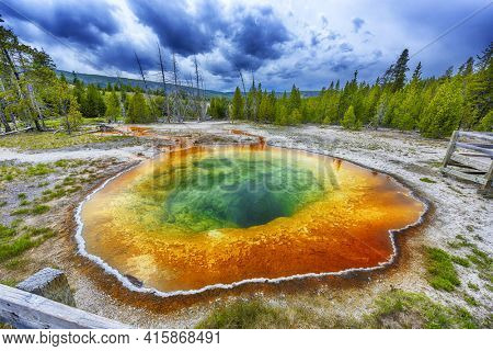  Morning glory pool from above. Stormy weather. Yellowstone National Park, Wyoming, USA