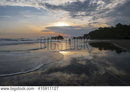 Amazing Beautiful Colored Sunset On The Ocean In Balian Beach With Water Reflections And Silhouette 