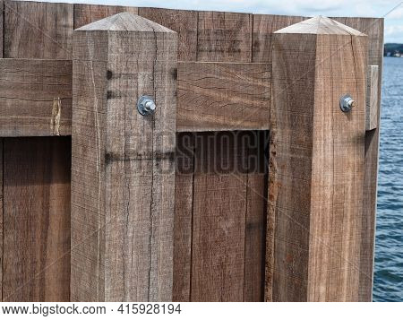 Wooden Dock Breakwall In A Marina Harbor Sailing And Boating Background Image