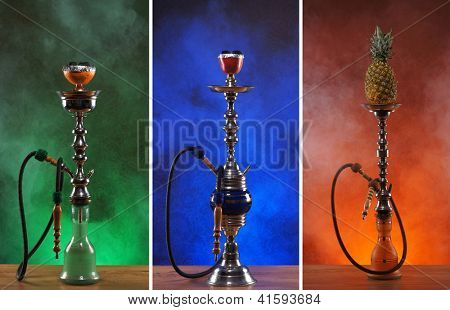 Pipas de agua diferentes sobre los fondos brillantes con humo