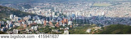 Aerial Panorama Of The City Of Cali Taken From The Top Of Cristo Del Rey Against A Blue Sky. Colombi