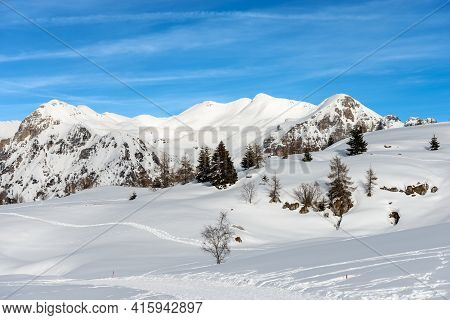 Snowy Winter Landscape Of The Lessinia Plateau (altopiano Della Lessinia) And Carega Mountain (monte