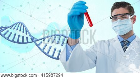 Caucasian male doctor holding a test tube against dna structure and network of connections. global networking and medical research technology concept