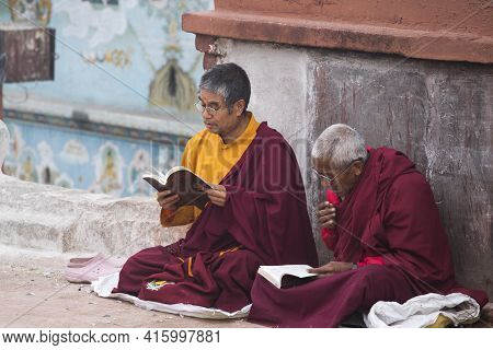 Nepal, Kathmandu, April 21: Unidentified Monks Praying At The Famous Bouddanath Temple In Kathmandu,