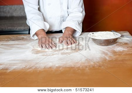 Baker Kneading A Dough