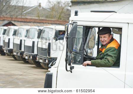 industrial dumper truck driver at vehicle automobile company autopark