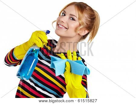 Spring cleaning woman ready for spring cleaning smiling with rubber gloves and cleaning products.