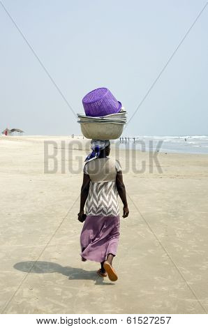 A Woman From Ghana African Nest On His Head Heavy Load.