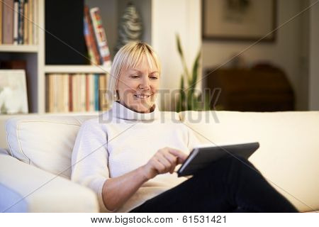 Senior Woman Using Touch Pad Device