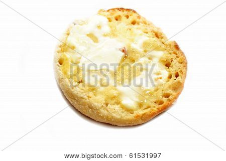 Buttered English Muffin Isolated On White