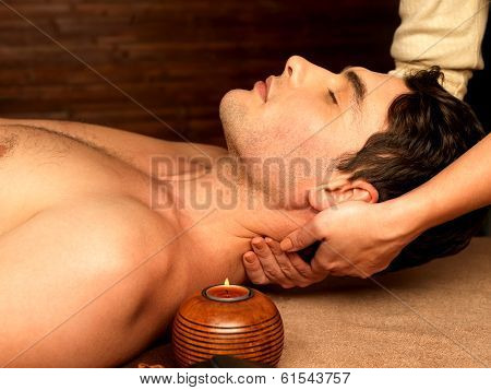 Man Having Neck Massage In The Spa Salon