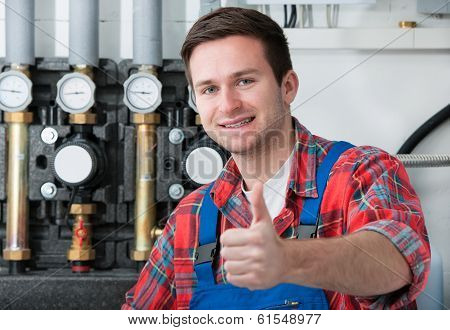 Technician Servicing Heating Boiler
