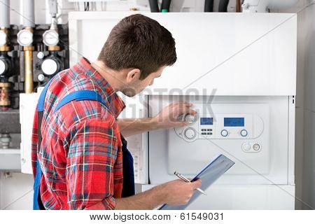Technician Servicing Heating Boiler
