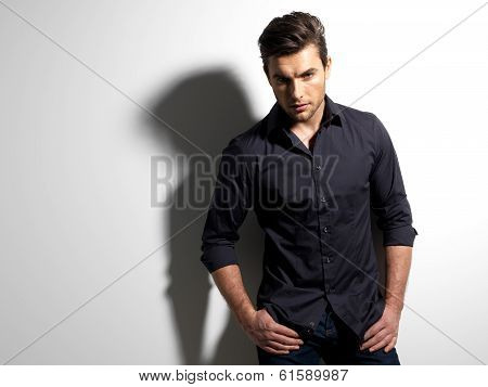 Fashion Portrait Of Young Man In Black Shirt