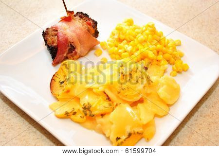 Gourmet Meal Of Potato Casserole With Bacon Wrapped Meatloaf