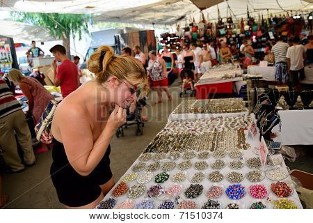 Woman Browsing Market