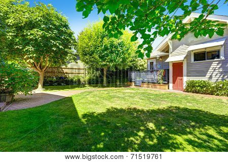Backyard Garden With Brick Tile Walkway