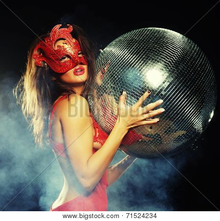 lady in mask with disco ball