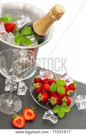 Festive Arrangement With Bottle Of Champagne And Strawberries