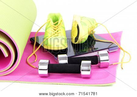 Sport requisites on a carpet isolated on white
