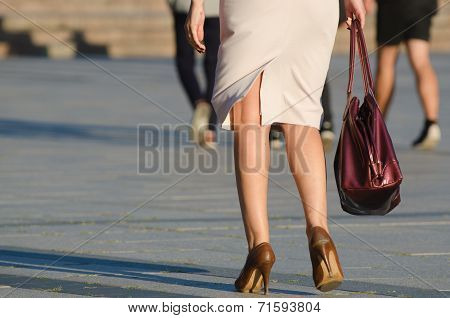 Legs of woman in the street
