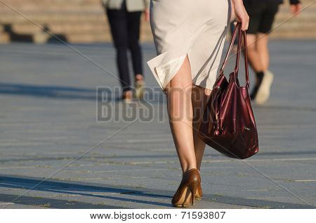 Legs of woman in the street