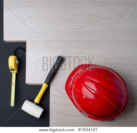 Texture Laminate And Tools With A Red Helmet