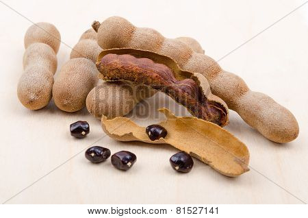 Dried Tamarind Fruits With Seeds On Wood
