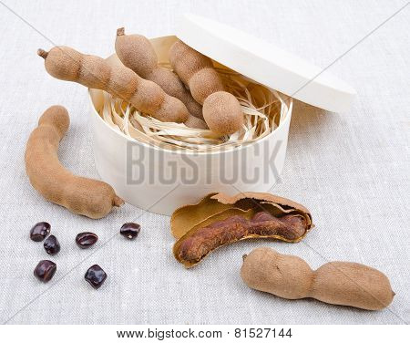 Dried Tamarind Fruits With Seeds In A Box On Linen