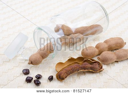 Dried Tamarind Fruits With Seeds In A Glass On Cotton