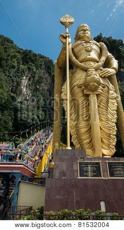 KUALA LUMPUR, MALAYSIA - JANUARY 31, 2015: Hindu devotees walk up the Sri Mahamarriamman temple built inside a limestone cave. Hundreds of thousands of devotees gather here for the Thaipusam prayers.