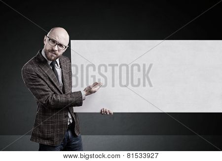 Man Holding Blank Paper On Gray Background